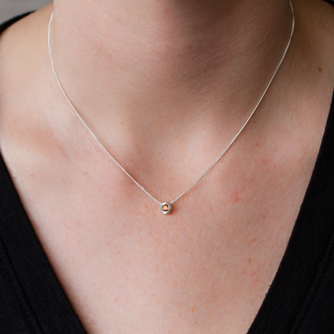 November birthstone Aurora slide necklace with citrine in silver on a neck