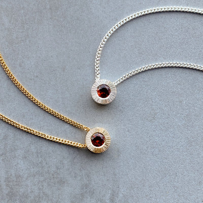 January birthstone Aurora slide necklace with garnet in silver in yellow gold