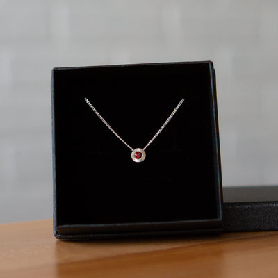 January birthstone Aurora slide necklace with garnet in silver in a gift box