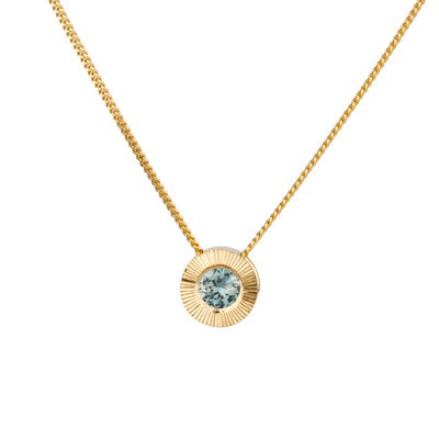 14k yellow gold Medium aurora necklace with a light teal Montana sapphire center on a white background