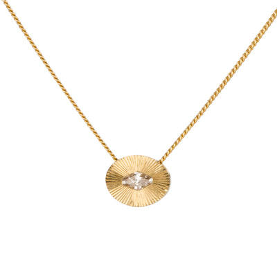 Antique step-cut diamond in a yellow gold oval aurora pendant with engraved rays