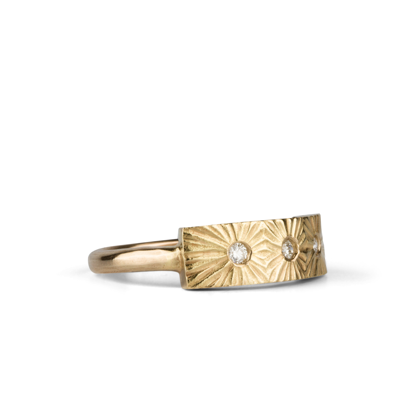 Yellow gold bar ring with three diamonds and a carved sunburst design around each by Corey Egan side view #2 on a white background