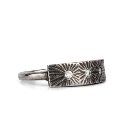 Nova Oxidized Silver and Diamond Ring by Corey Egan on a white background side view