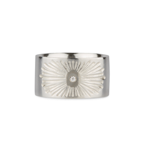 Sterlign silver wide band with single diamond and a carved sunburst design on a white background by Corey Egan