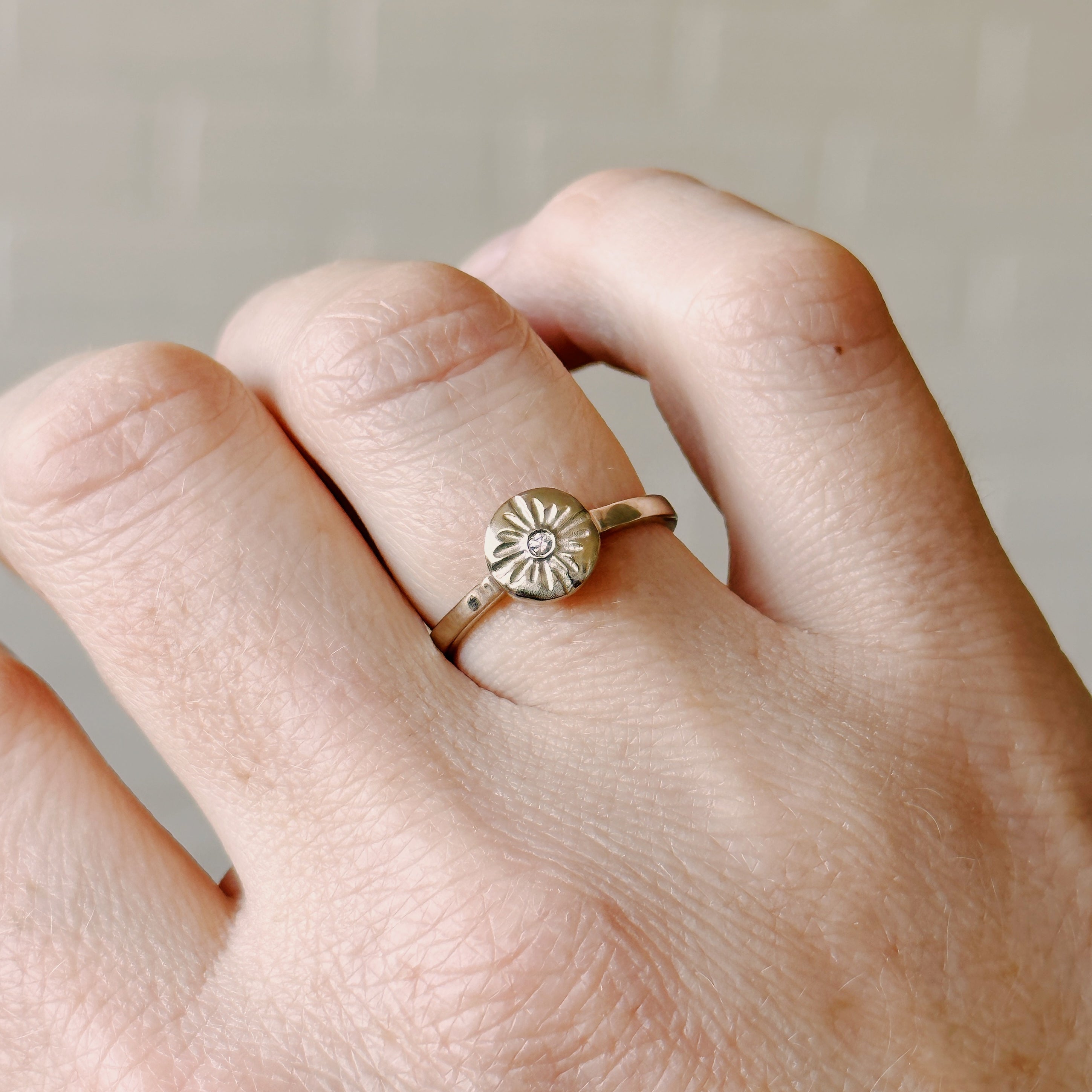 Lucia Small White Gold and Diamond Ring modeled on a hand