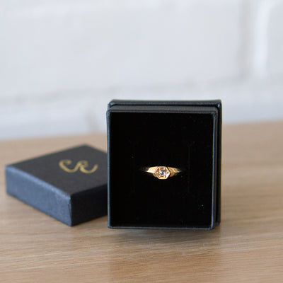 Yellow gold signet ring with bead set rose cut salt and pepper diamond in a gift box