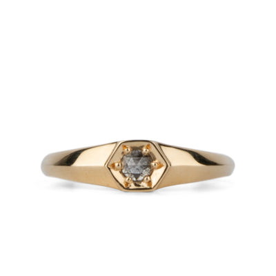 Yellow gold signet ring with bead set rose cut salt and pepper diamond on a white background