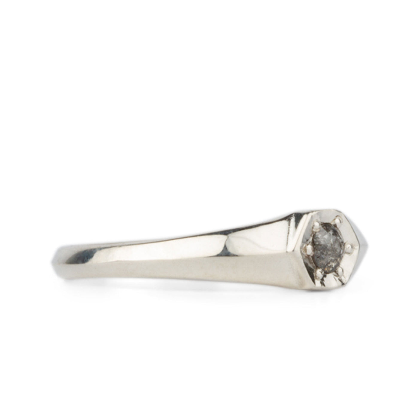 Side view of Sterling silver signet ring with bead set rose cut salt and pepper diamond on a white background