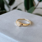 Gold low profile signet ring with a hexagon face 