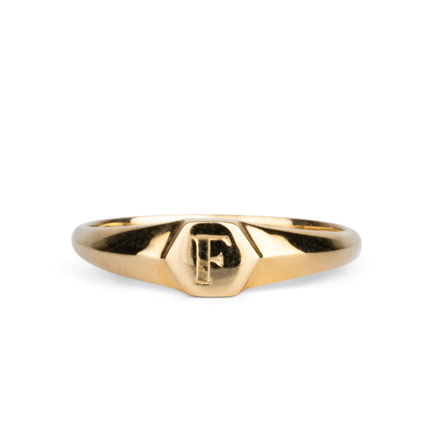 Low profile gold signet ring with hexagon top and engraved single block "F" initial
