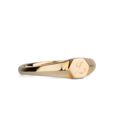 Low profile gold signet ring with hexagon top and engraved single script "L" initial
