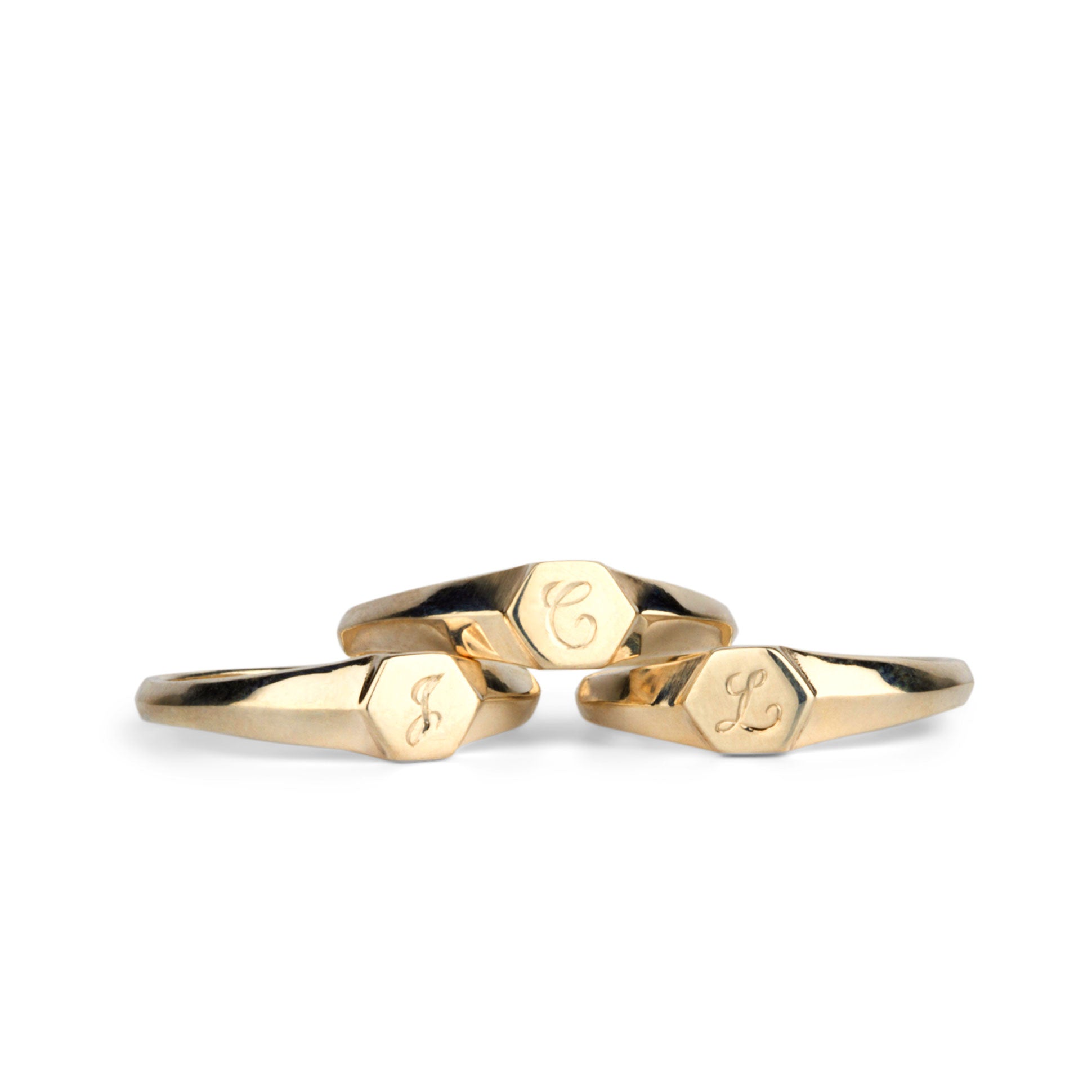 Low profile gold signet ring with hexagon top and engraved single script initial