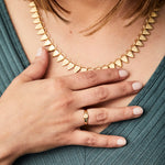 Gold low profile signet ring with a hexagon face 