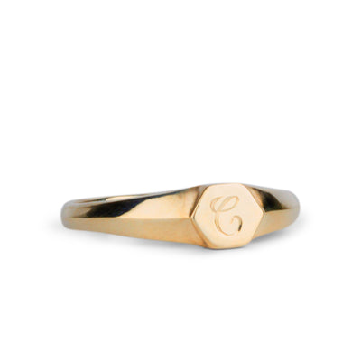 Low profile gold signet ring with hexagon top and engraved single script "C" initial