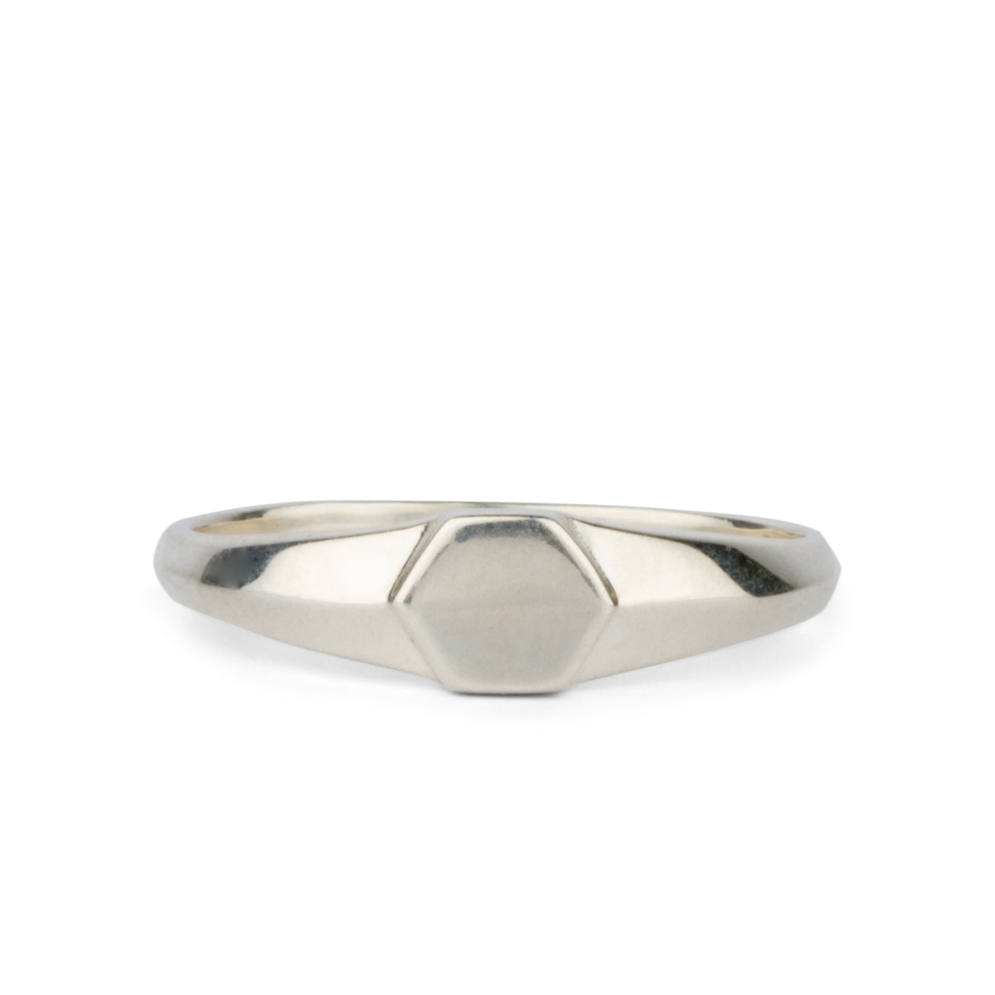 Sterling silver low profile signet ring with a hexagon face on a white background
