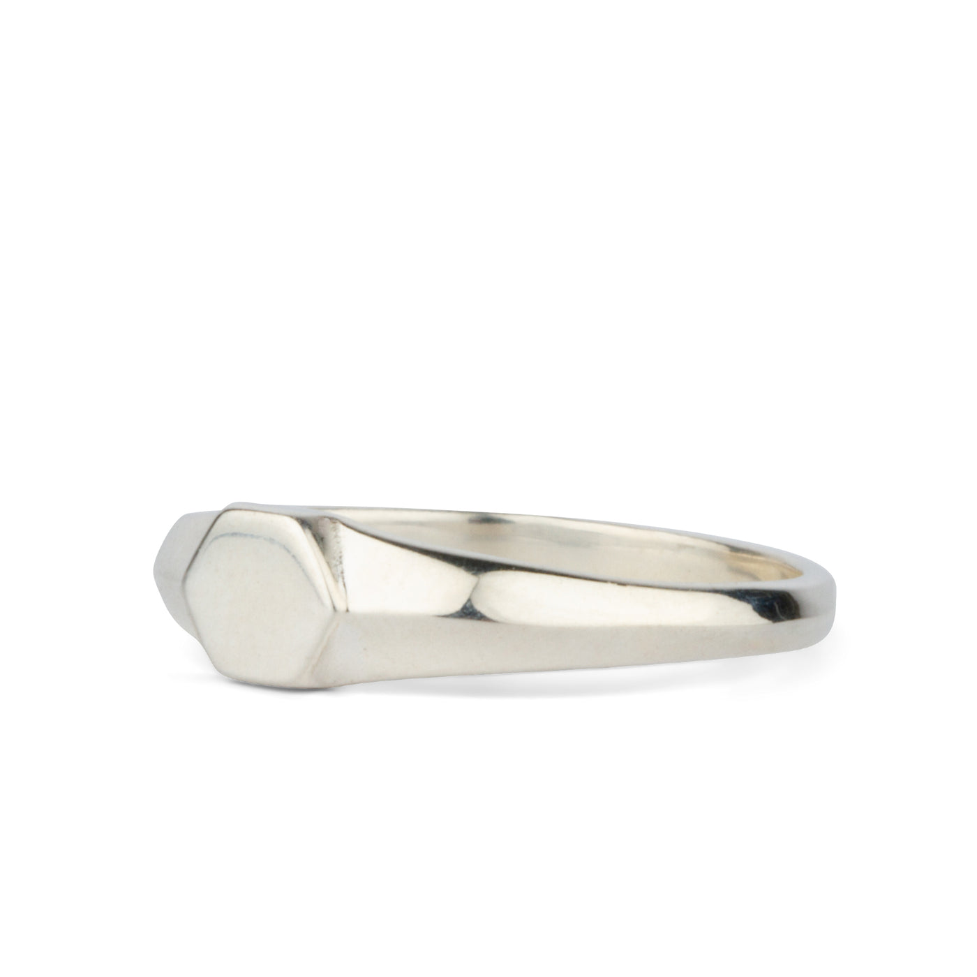 Side view of Sterling silver low profile signet ring with a hexagon face on a white background