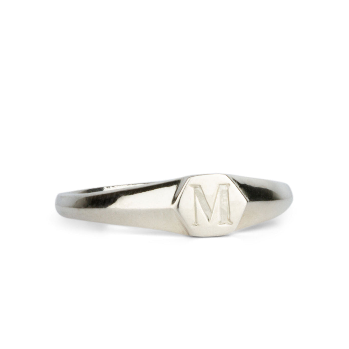 Low profile silver signet ring with hexagon top and engraved single block "M" initial