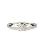 Low profile sterling silver signet ring with a hexagon shaped face and a white center diamond 