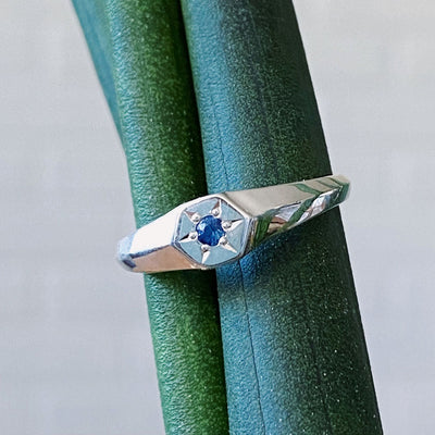 Hexagon silver signet ring with a star set sapphire center