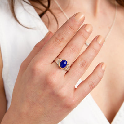 Oval Rose cut Lapis Silver and Gold Sunburst Ring on a hand