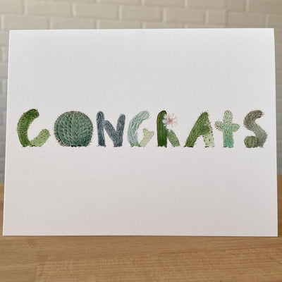 Watercolor Card with 'Congrats' spelled in Letters shaped like cacti.