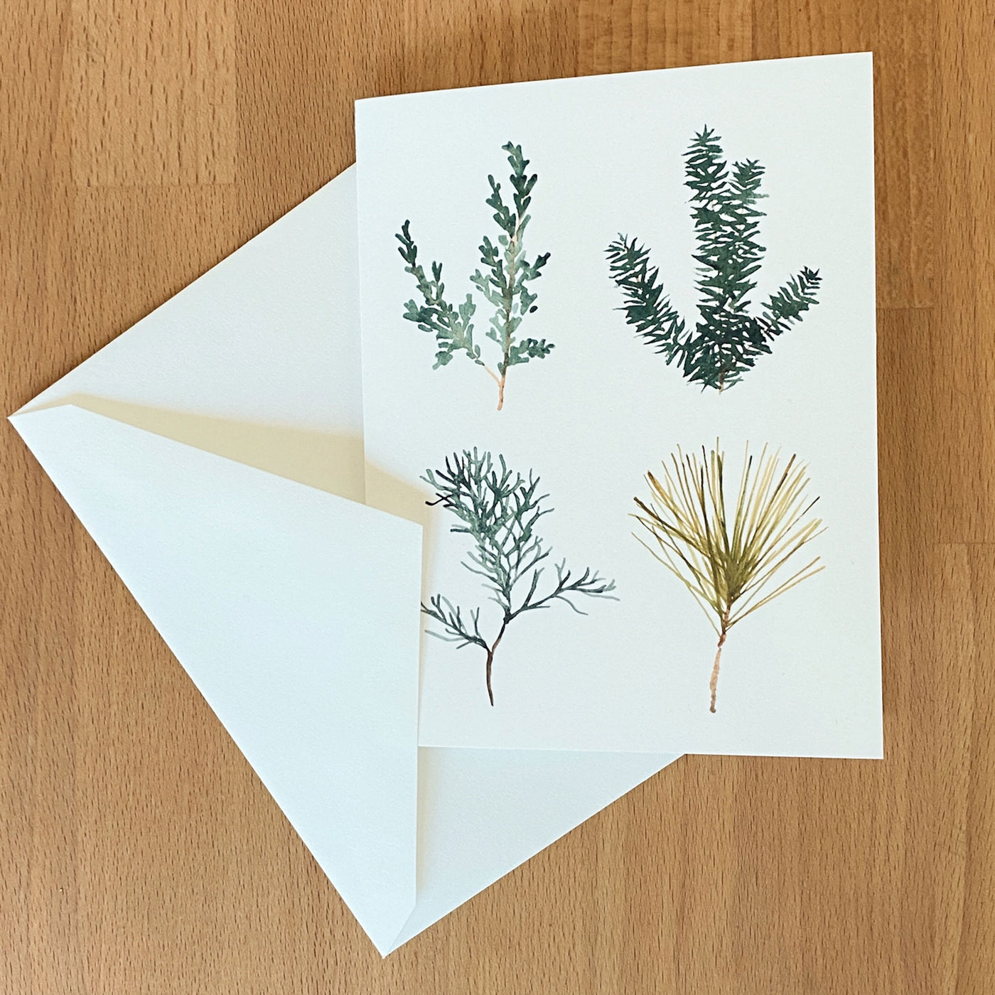 Watercolor Card of four pine tree sprigs