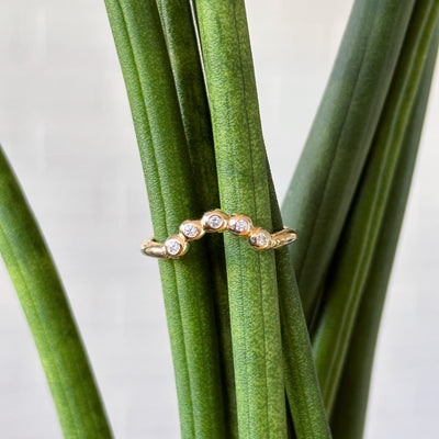 Medium Arched Droplet band in 14k yellow gold with white diamonds by Corey Egan