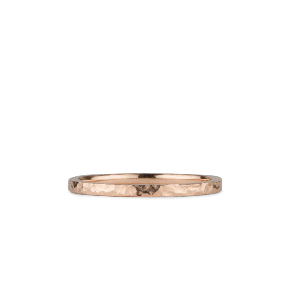 1.5mm wide Rose Gold Blue Ridge Hammered Flat Band on a white background by Corey Egan