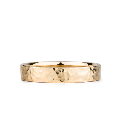 Blue Ridge Yellow Gold Hammered Flat Band 4mm wide on a white background by Corey Egan