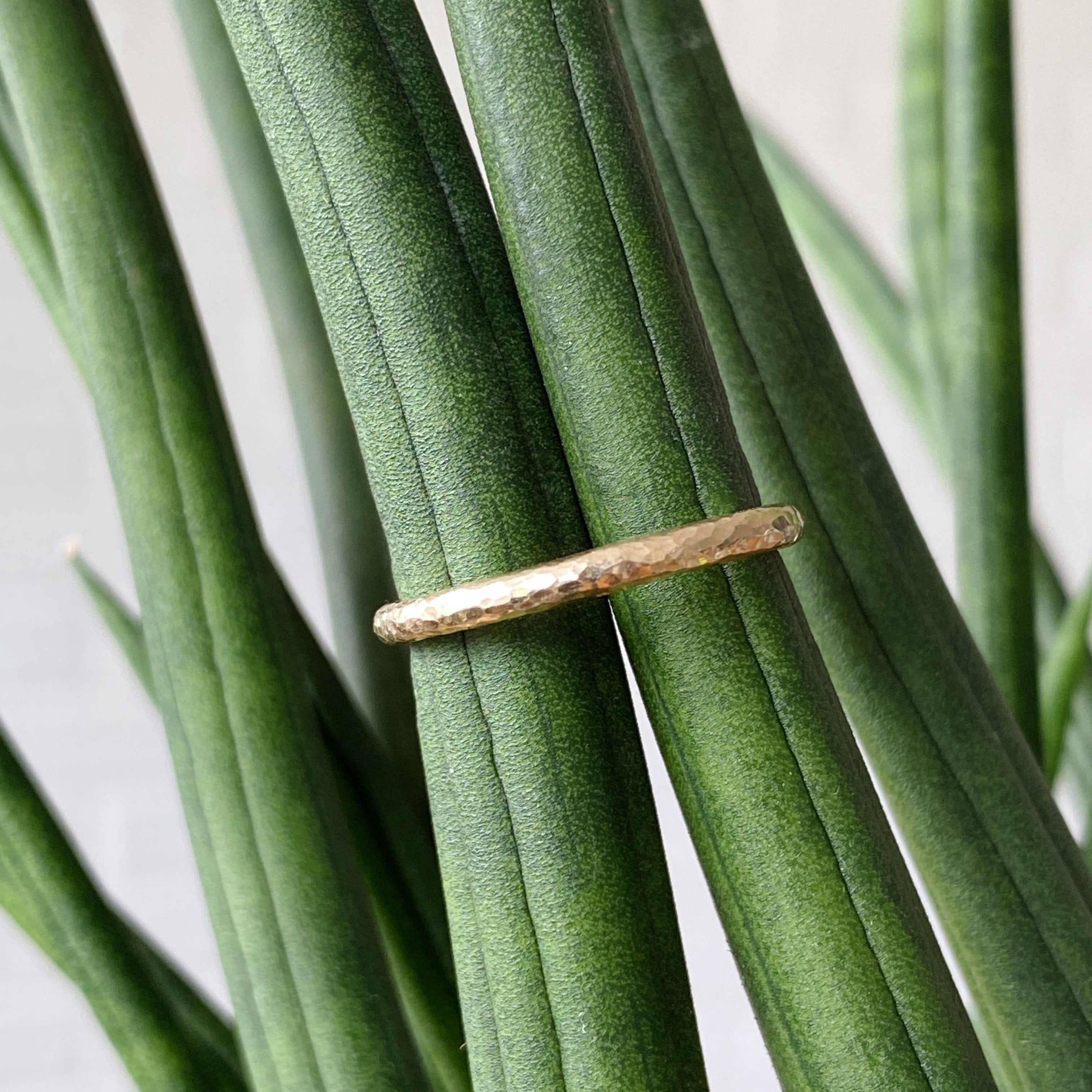Blue Ridge Half round hammered yellow gold wedding band in natural light