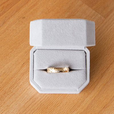 Blue Ridge half round wide yellow gold wedding band in a ring box