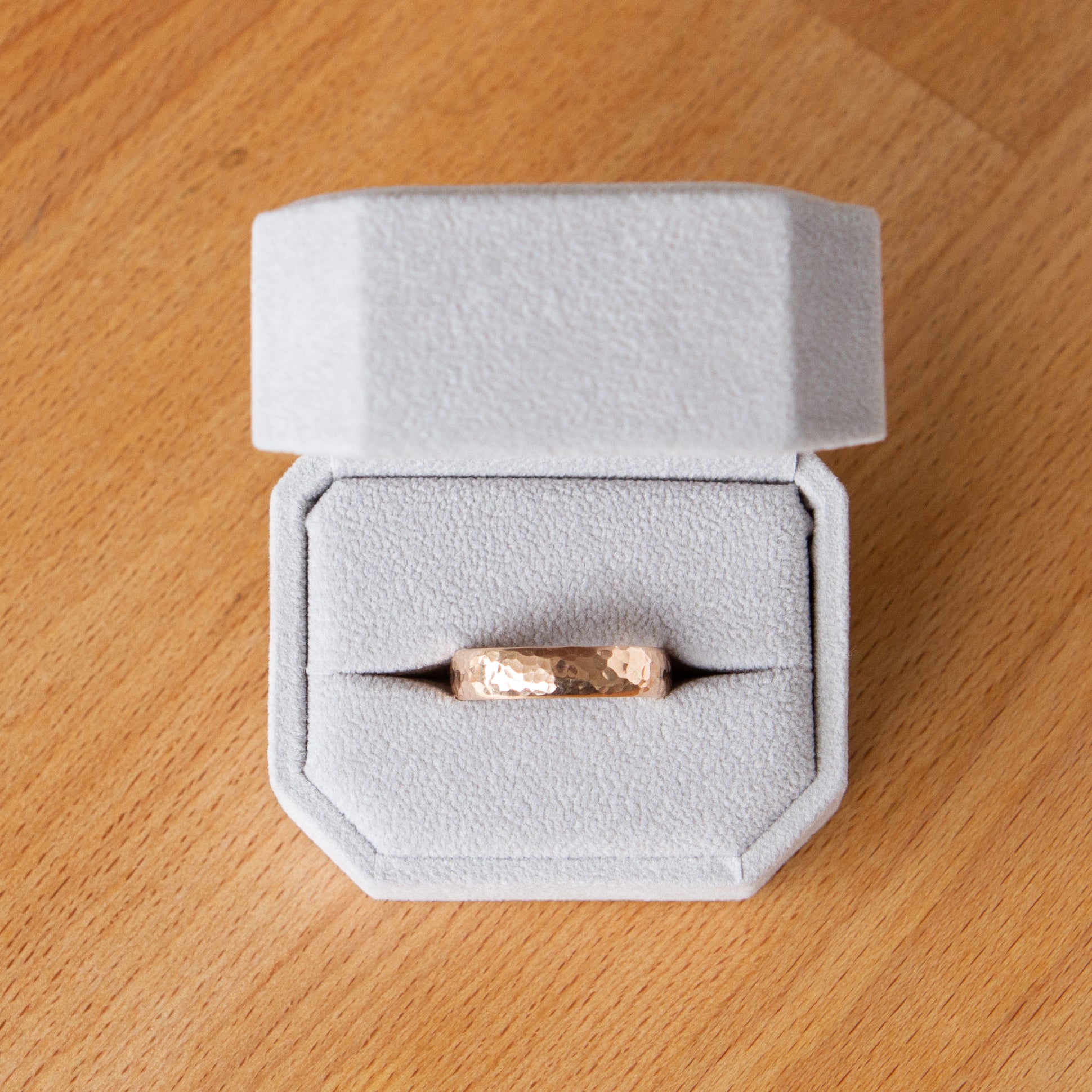 Blue Ridge half round wide rose gold wedding band in a ring box