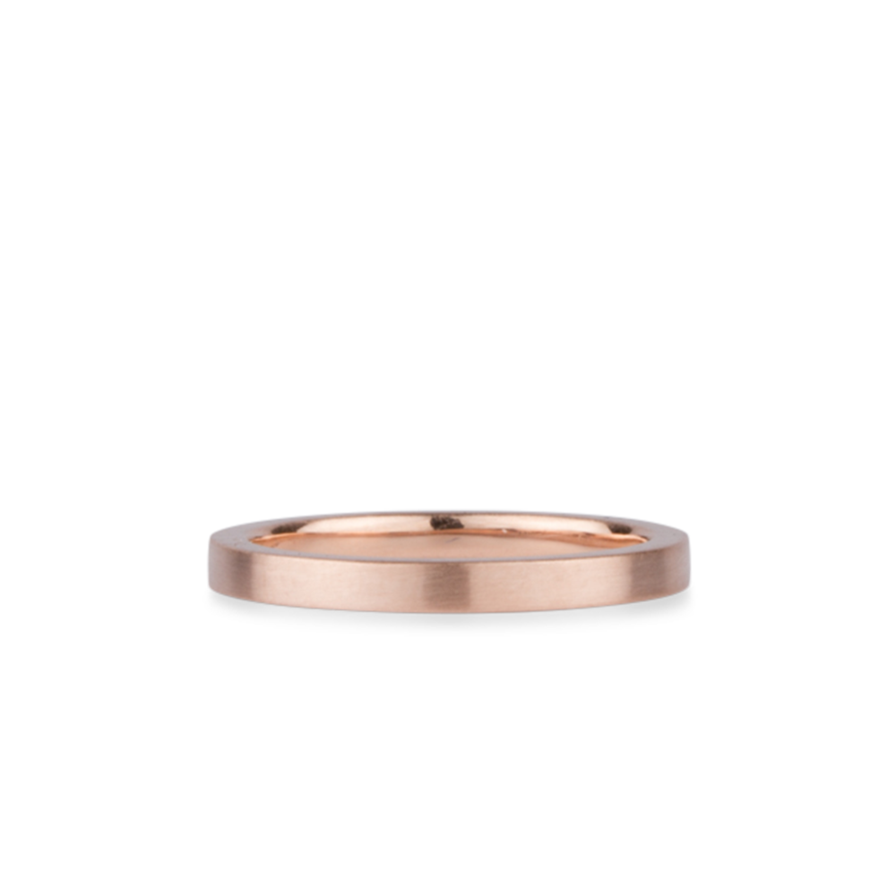 Thin 2mm Diablo flat brushed rose gold wedding band on a white background by Corey Egan