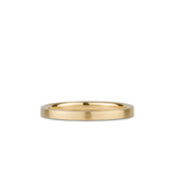 Thin 2mm Diablo flat brushed yellow gold wedding band on a white background by Corey Egan