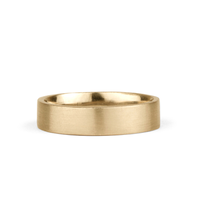 5mm Wide Diablo flat brushed yellow gold wedding band on a white background by Corey Egan