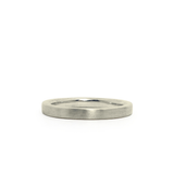 Thin 2mm Diablo flat brushed white gold wedding band on a white background by Corey Egan