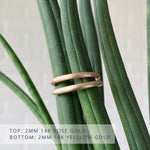 Thin half round Diablo brushed wedding bands. Top is rose gold, bottom is yellow gold.