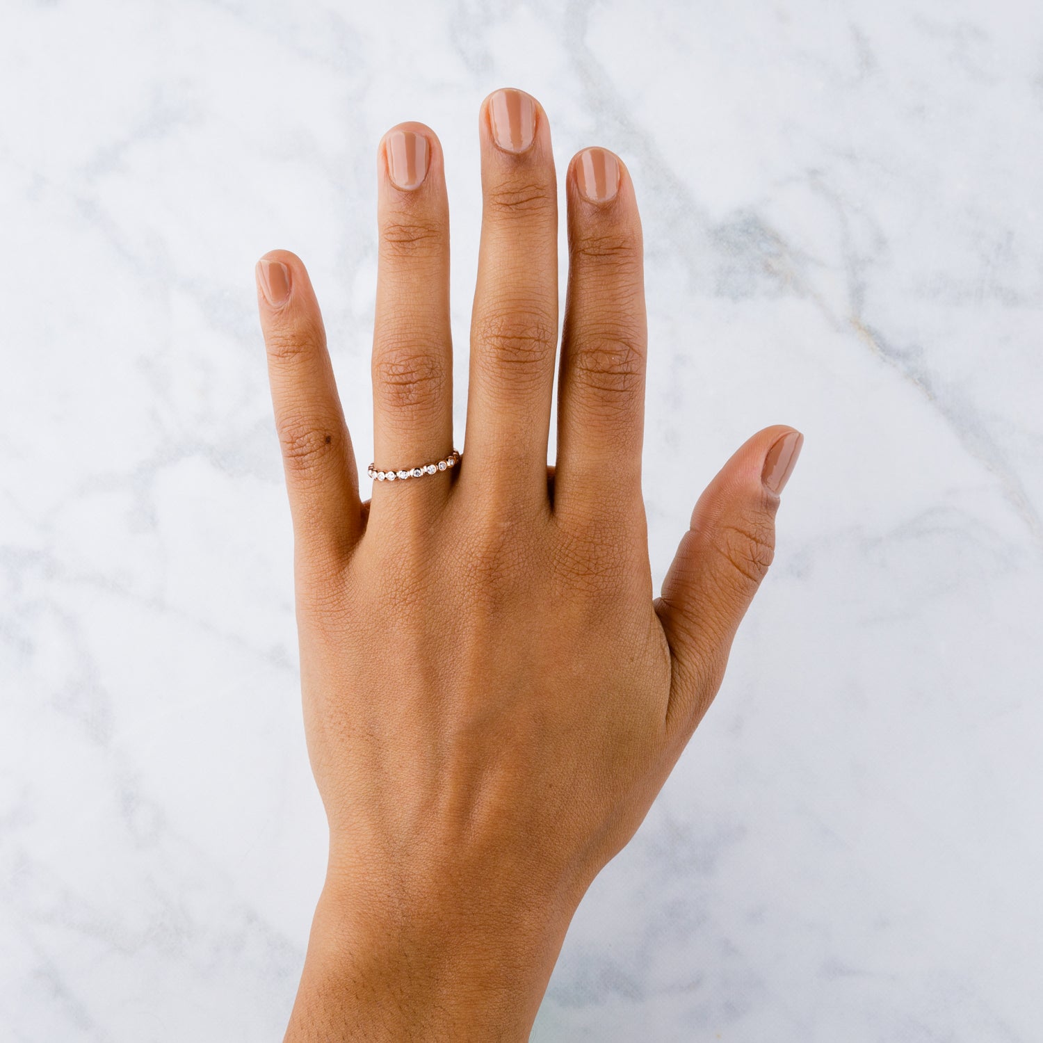 White Diamond Droplet Band in Rose Gold on a hand | Corey Egan
