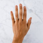 White Diamond Droplet Band in Yellow Gold on a hand | Corey Egan