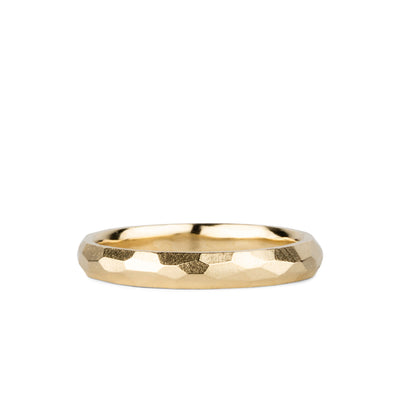 Thin faceted yellow gold wedding band