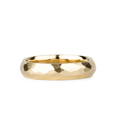 Wide faceted yellow gold wedding band