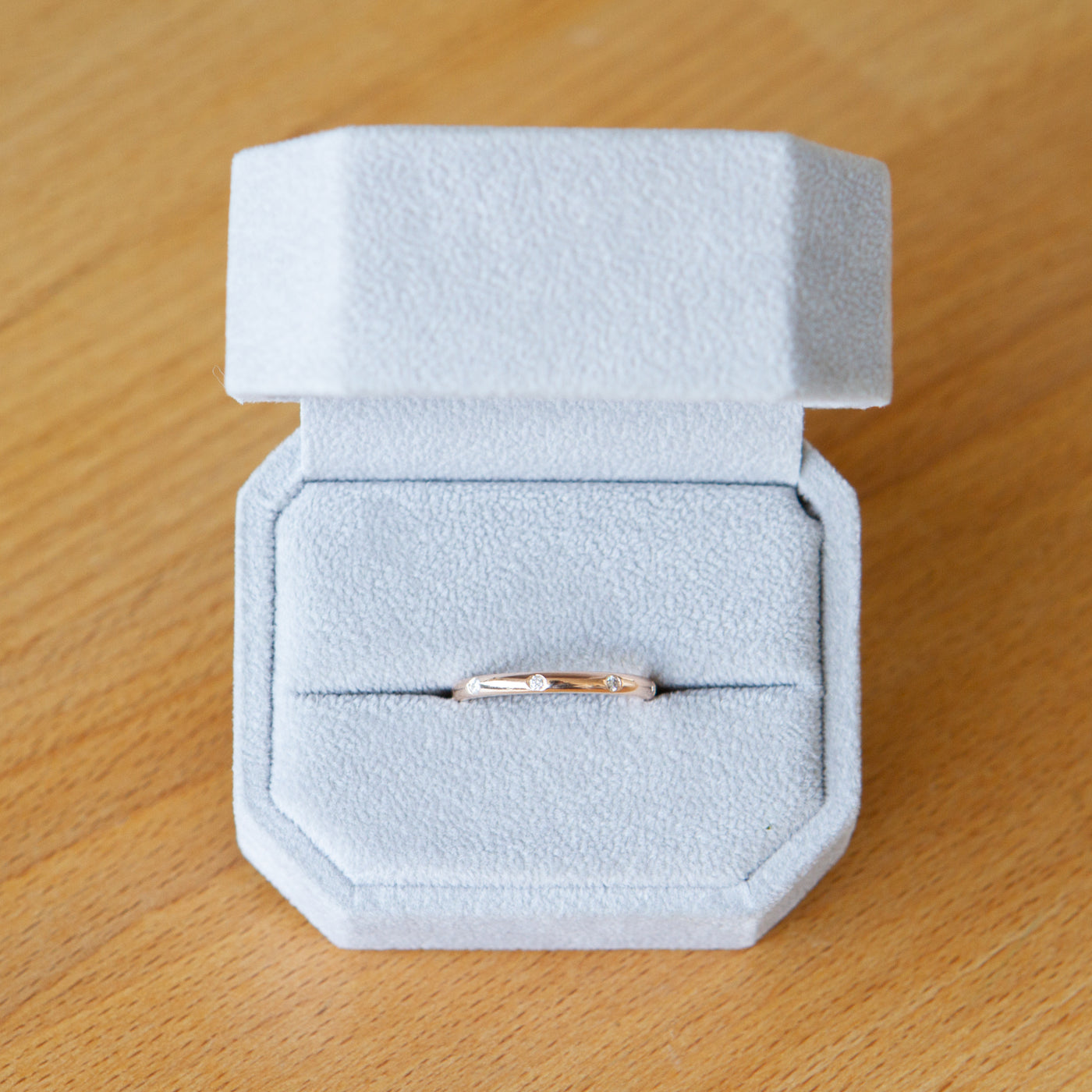 14k rose gold lassen band in a ring box
