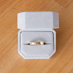 Shiny flat Muir wedding band 4mm wide in a ring box