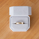 Shiny flat Muir wedding band 4mm wide in a ring box
