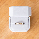 Shiny flat Muir wedding band 5mm wide in a ring box