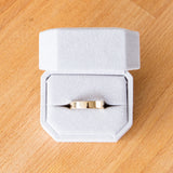 Shiny flat Muir wedding band 5mm wide in a ring box