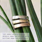 Shiny flat Muir wedding bands 4mm wide in 3 colors: 14k white gold (top) 14k yellow gold (middle) 14k rose gold (bottom)