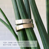 Shiny Flat Muir wedding band 5mm wide in 14k white gold (top) and 5mm wide in 14k yellow gold (bottom)
