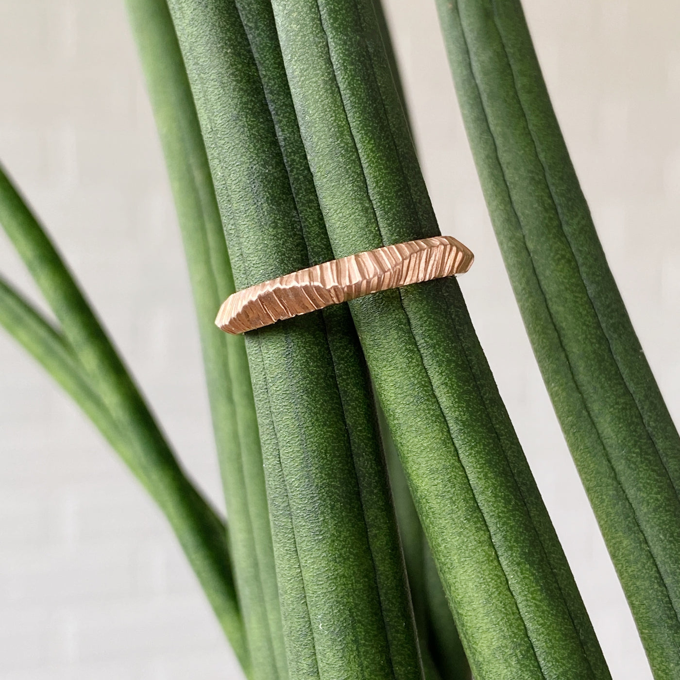 Napali undulating carved texture wedding band in 14k rose gold