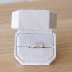 14k white gold small pave diamond arch band in a ring box